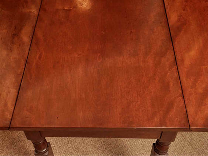 Antique Cherry Drop Leaf With Turned Legs On Casters Dining Table