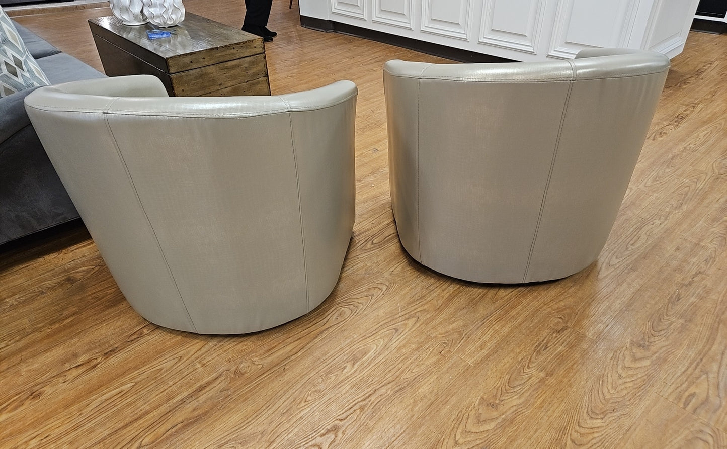 Pair Of Champagne Swivel Chairs