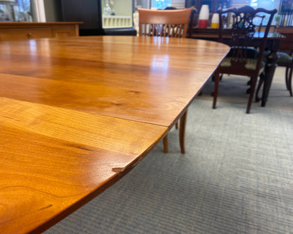 A. Sibau Round Dining Table with Leaves & Set of 6 Spindle-back Chairs in Cherry