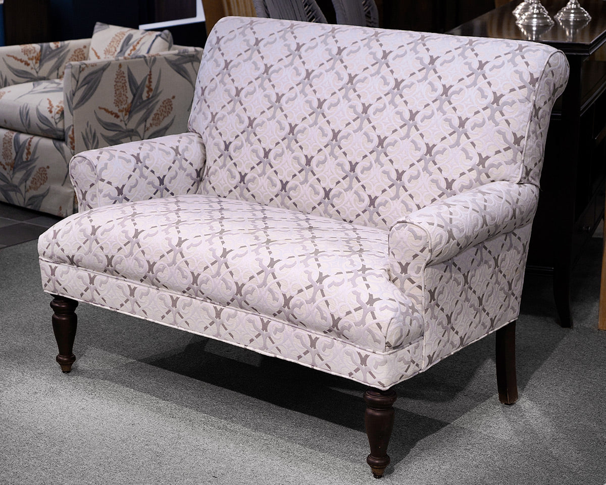 Upholstered Settee with Rolled Arms and Turned Legs