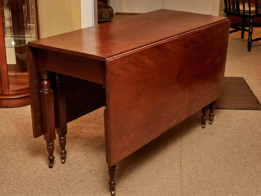 Antique Cherry Drop Leaf With Turned Legs On Casters Dining Table