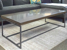 Lorts Driftwood Finish Top Cocktail Table with Taupe Metal Base