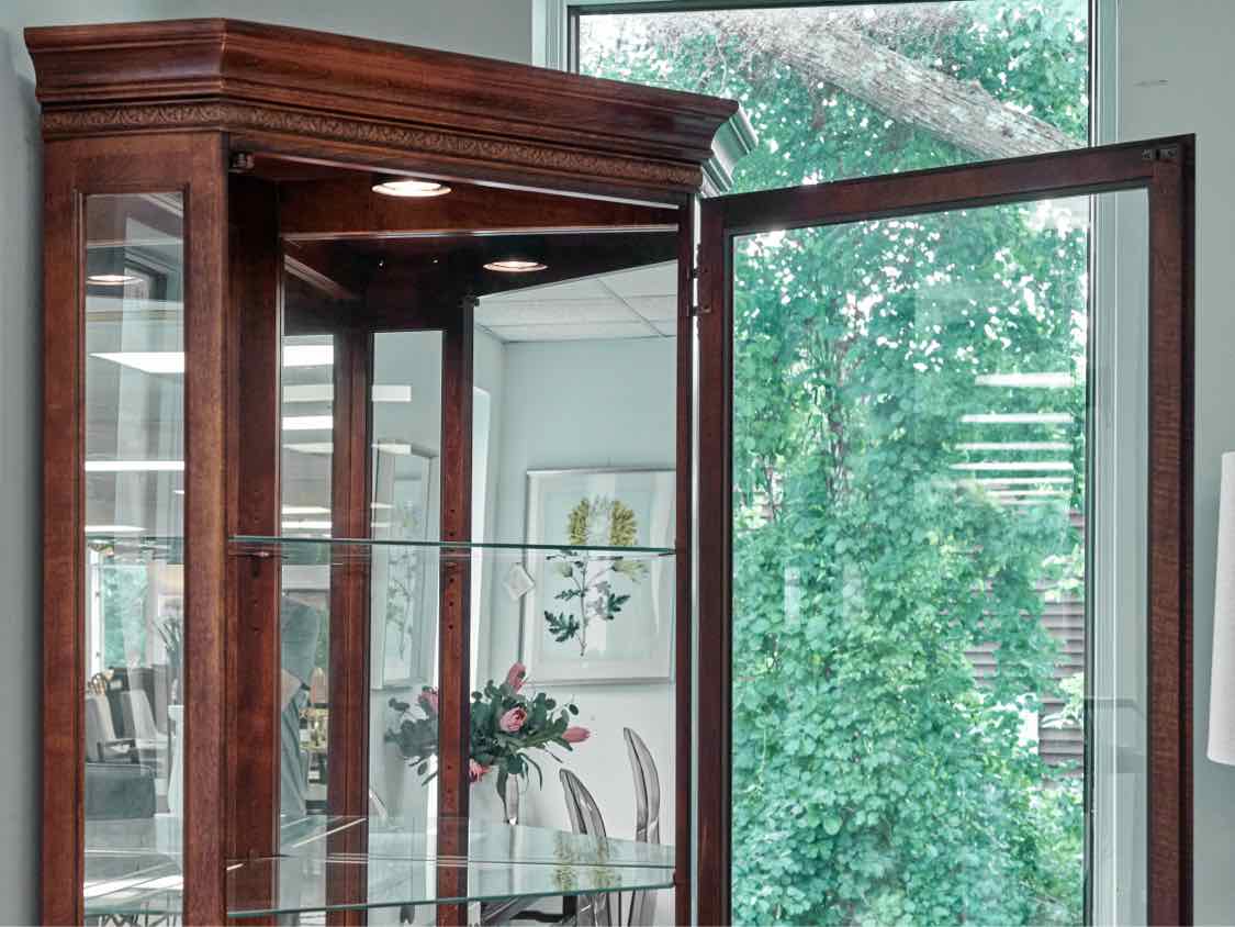 Howard Miller Lighted Cherry Corner Display Cabinet