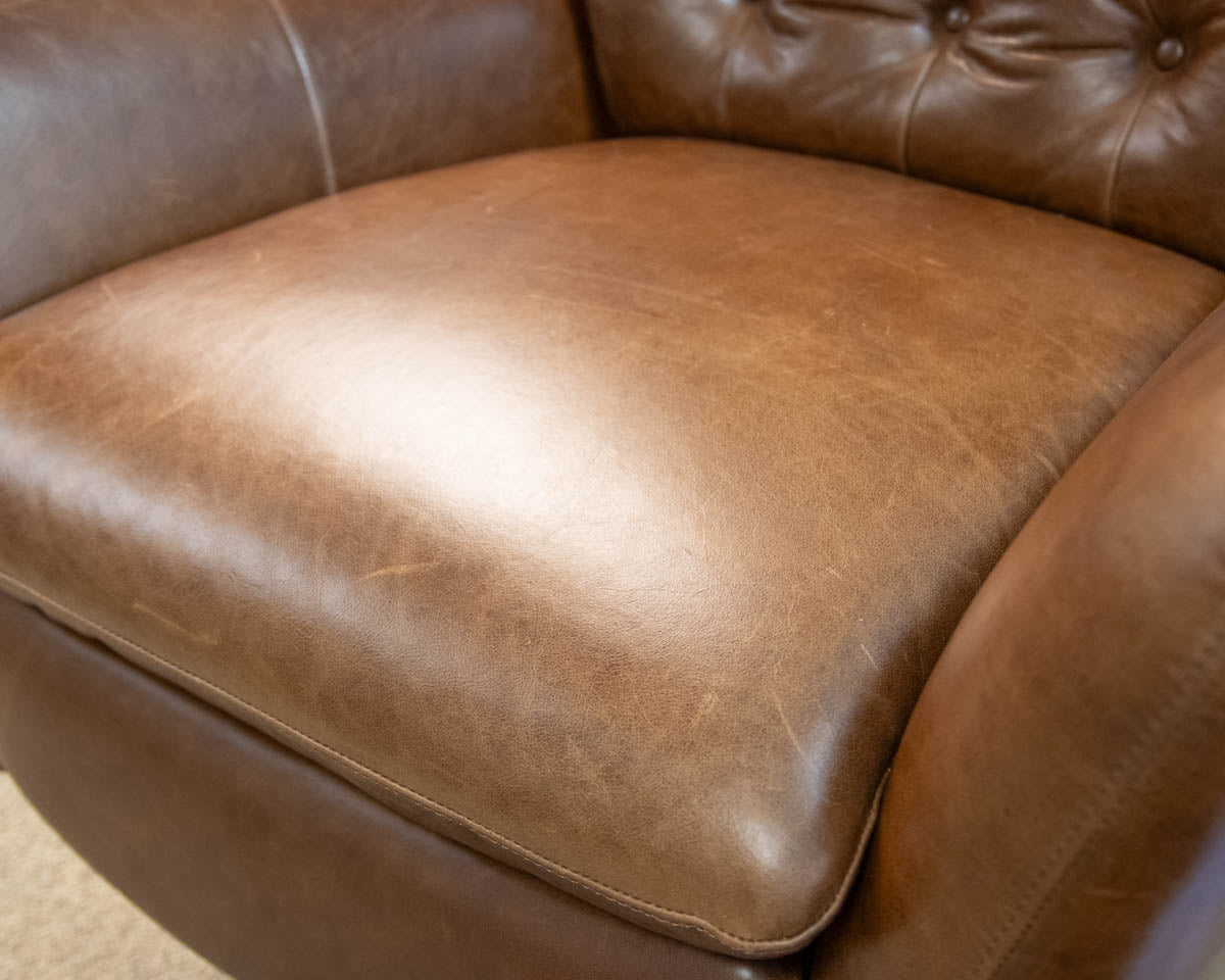 Pottery Barn Wells Tufted Swivel Recliner in Molasses Leather