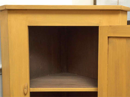 Corner Cabinet with Raised Panel Door in Butter Yellow Finish