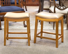 Pair of Counter Stools in Buff Faux Leather on Honey Finish Frame