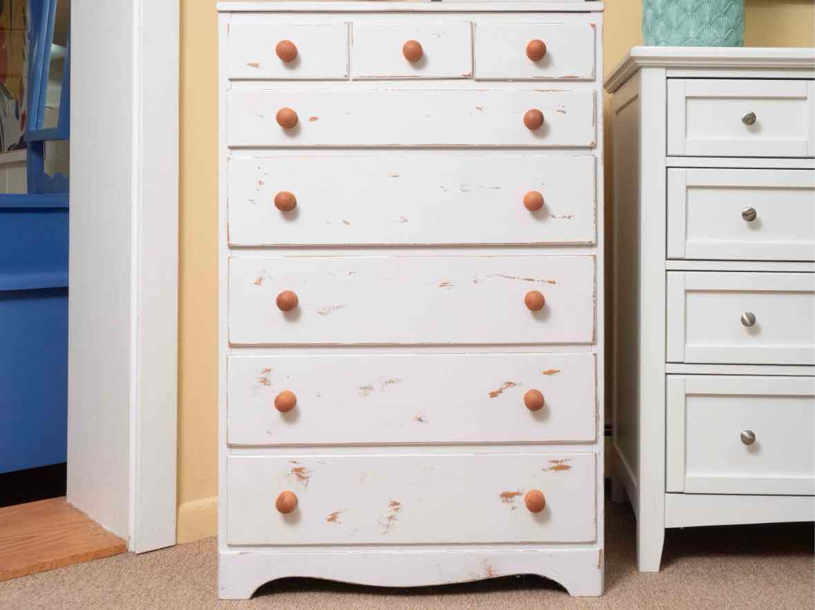 Distressed White Finish 8 Drawer Chest with Wooden Knobs