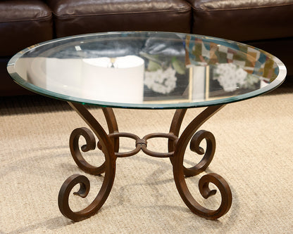 Comina Round Glass and Iron Scroll Base Cocktail Table