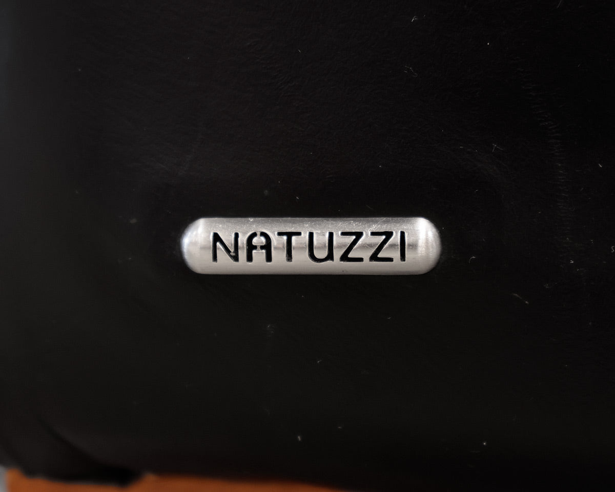 Natuzzi Black Leather Chair and Ottoman