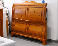 Queen Sleigh Bed in a Knotty Pine Wood