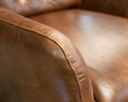 Pottery Barn Wells Tufted Swivel Recliner in Molasses Leather
