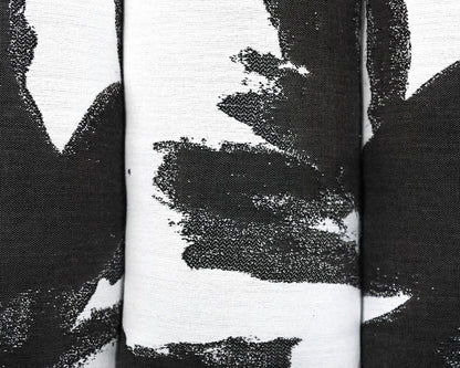 Contemporary Channel-Tufted Ottoman in Black & White