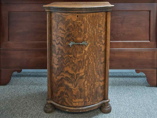 Curved Front Cabinet in Quartersawn Oak on Bun Feet with Brass Pull