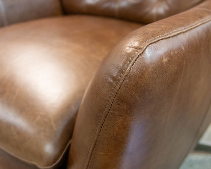 Pottery Barn Wells Tufted Swivel Recliner in Molasses Leather