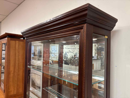 Pulaski Lighted Side Entry Curio Cabinet in Cherry