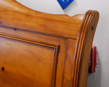 Queen Sleigh Bed in a Knotty Pine Wood