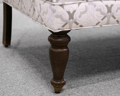 Upholstered Settee with Rolled Arms and Turned Legs