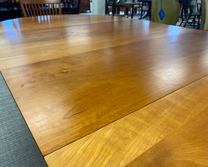 A. Sibau Round Dining Table with Leaves & Set of 6 Spindle-back Chairs in Cherry