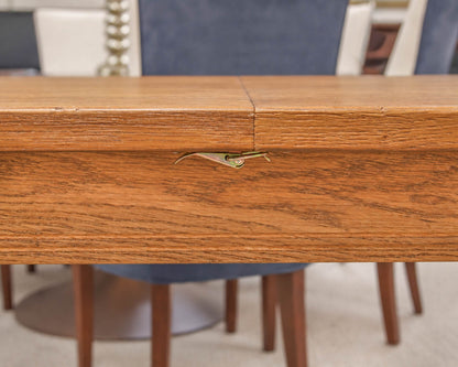 Oak Dining Table W/ 2 Leaves  In Honey Finish Featuring An H-Stretcher Base