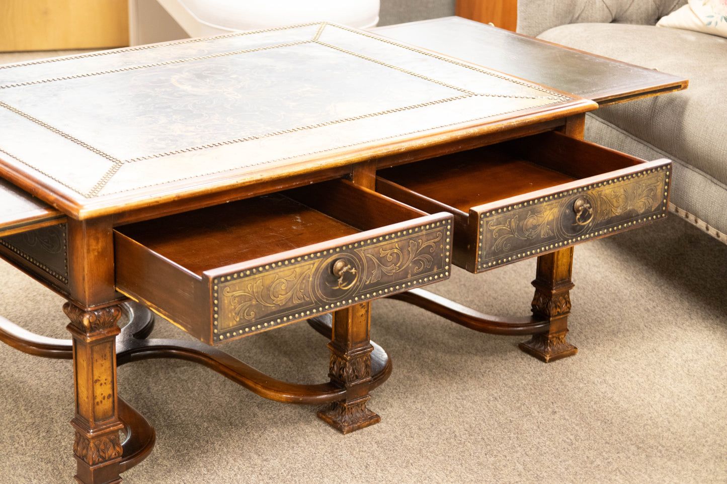Regency Cocktail Table with Embossed Brass Panels and Side Pullouts