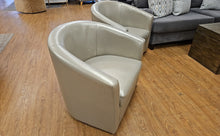 Pair Of Champagne Swivel Chairs