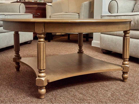 Synergy House  Stained Ash Round With Lower Shelf Turned Legs Cocktail Table