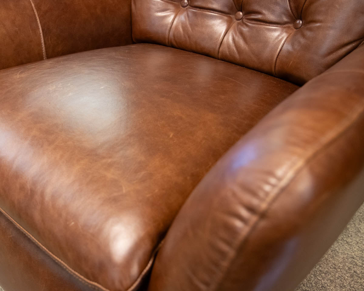 Pottery Barn Wells Tufted Swivel Recliner in Molasses Leather