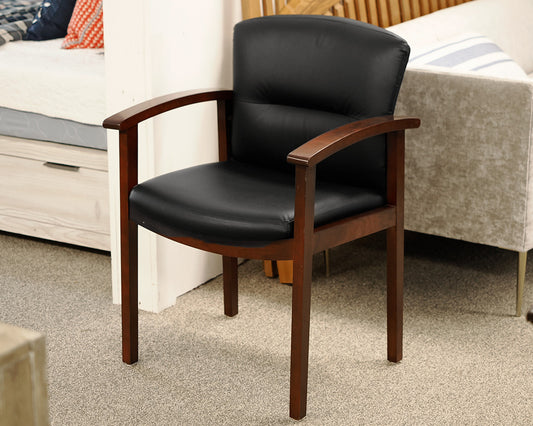 Black Faux Leather Office Chair on Dark Wood Frame