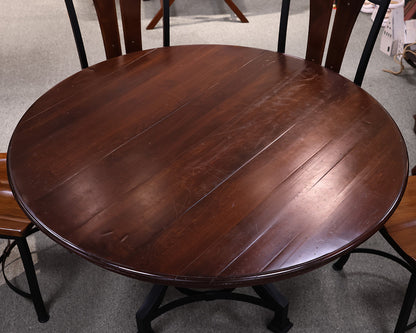 Round Mahogany Table With Metal Base and Six Chairs