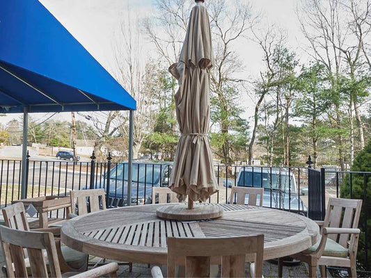 Outdoor Dining Set in Teak with 84" Round Dining Table, 8 Chairs & Umbrella