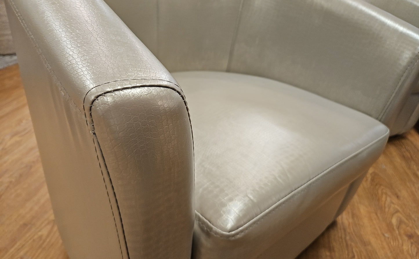 Pair Of Champagne Swivel Chairs