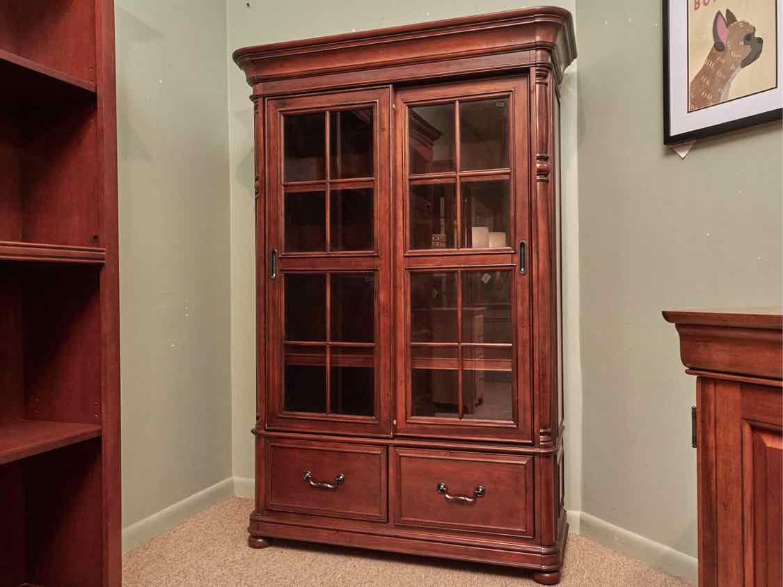 Riverside  Stained Cherry 2 Glass Sliding Doors 3 Shelf 2 Drawers Bookcase