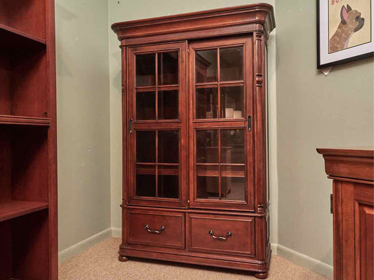 Riverside  Stained Cherry 2 Glass Sliding Doors 3 Shelf 2 Drawers Bookcase