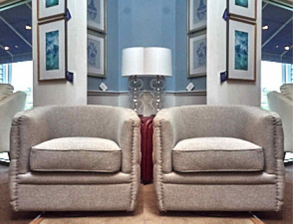 Pair of Dove Grey Upholsteted Swivel Chairs