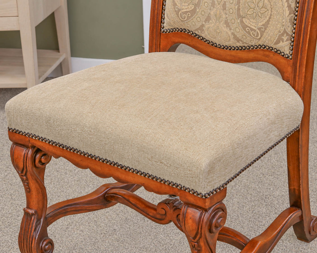 Set of 8 Carved Dining Chairs with Pale Gold Upholstery & Bronze Nailhead Trim