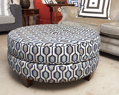 Upholstered In Shades Of Blue Round Ottoman