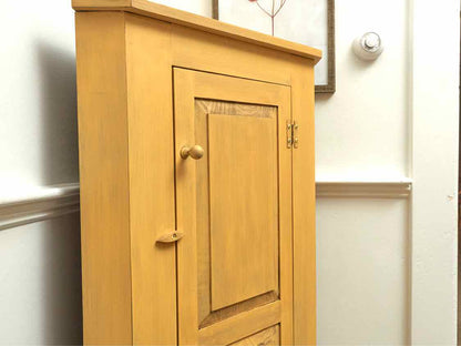 Corner Cabinet with Raised Panel Door in Butter Yellow Finish