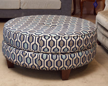 Upholstered In Shades Of Blue Round Ottoman