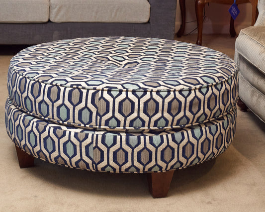 Upholstered In Shades Of Blue Round Ottoman