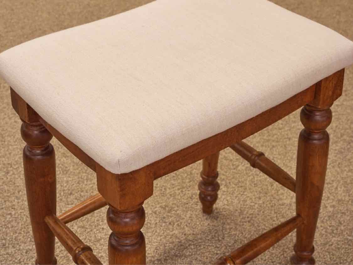 Pair of Linen Seat Counter Stools on Medium Finish Wood Frame