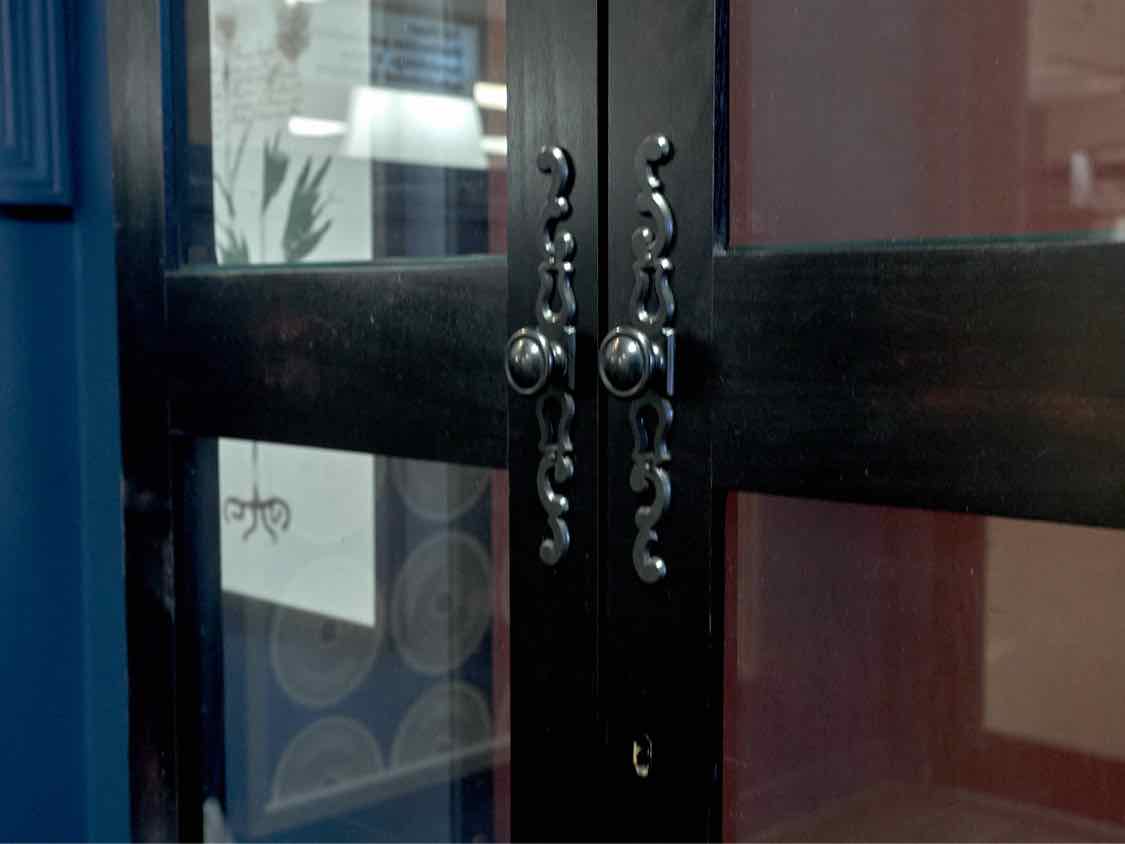 Howard Miller Black Lighted Two Door Display Cabinet with Red Rub Through
