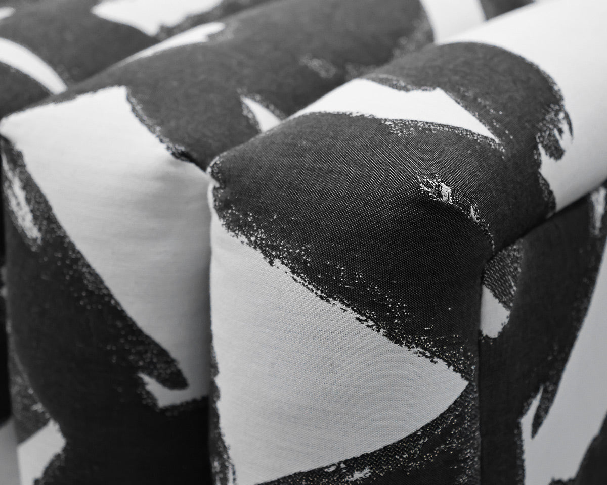 Contemporary Channel-Tufted Ottoman in Black & White