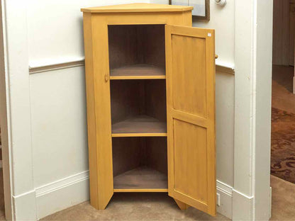Corner Cabinet with Raised Panel Door in Butter Yellow Finish