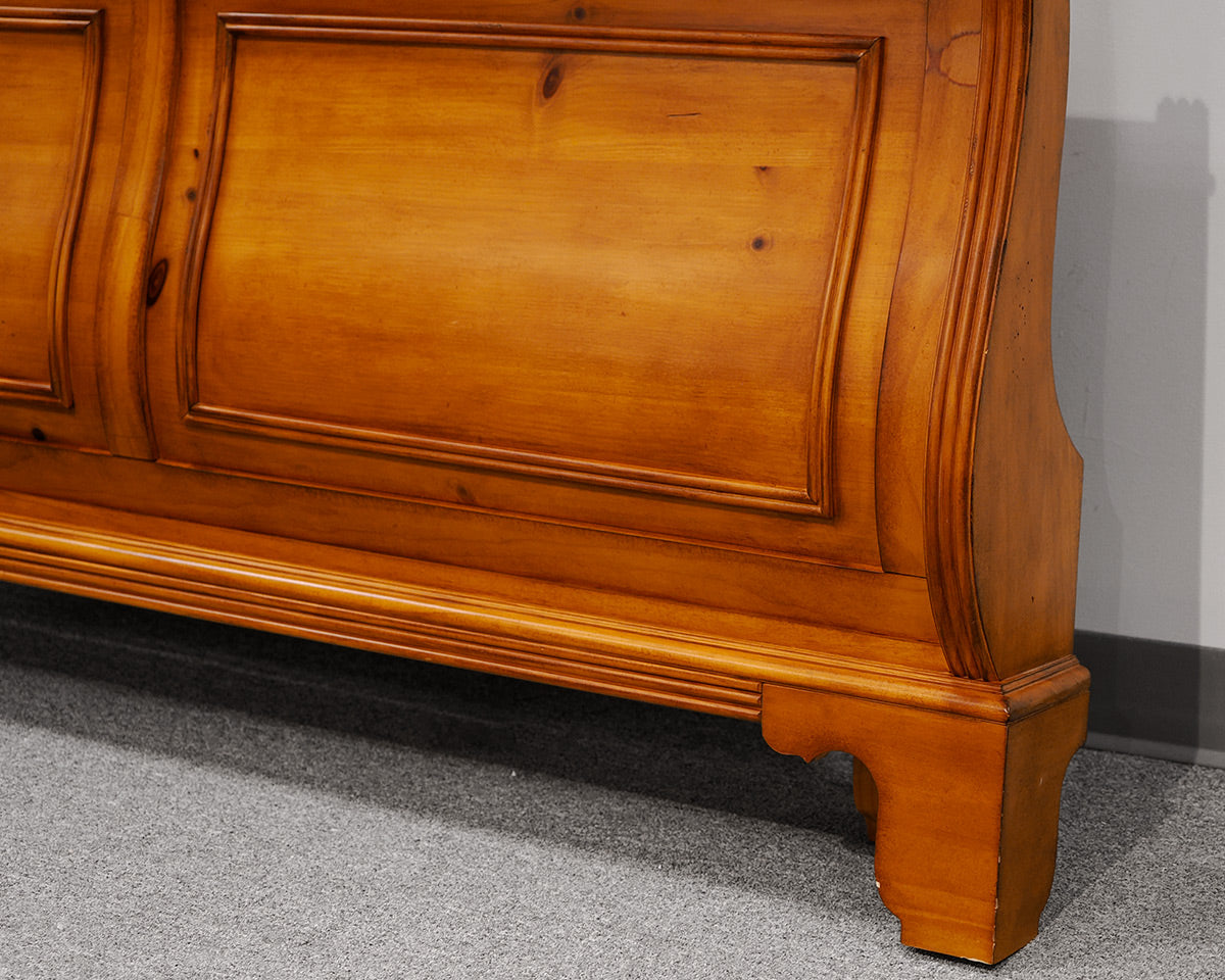 Queen Sleigh Bed in a Knotty Pine Wood