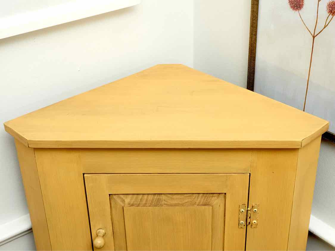 Corner Cabinet with Raised Panel Door in Butter Yellow Finish