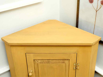 Corner Cabinet with Raised Panel Door in Butter Yellow Finish
