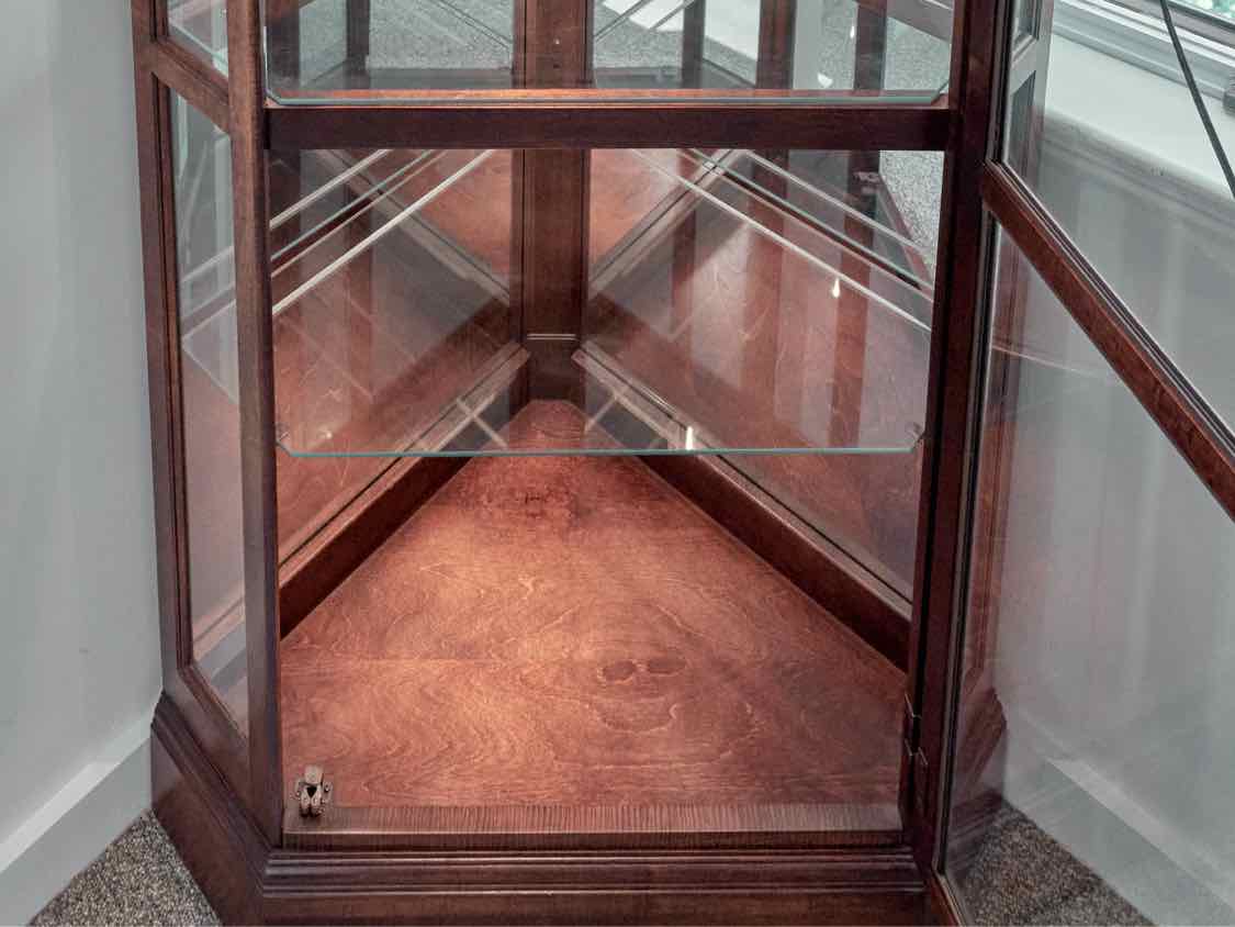Howard Miller Lighted Cherry Corner Display Cabinet