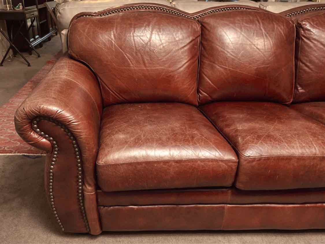Robinson & Robinson Inc  Amber Cognac Leather 3 Cushion Nailhead Trim Sofa