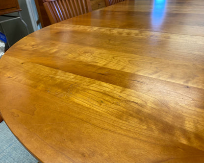 A. Sibau Round Dining Table with Leaves & Set of 6 Spindle-back Chairs in Cherry