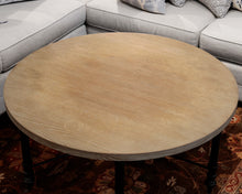 Round Natural Wood Cocktail Table With Black Metal Base